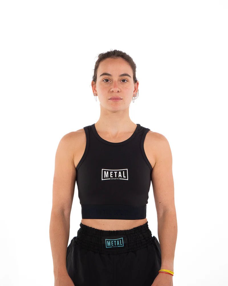Front view of the black Metal Boxe Donna compression tank top with full belly and chest coverage