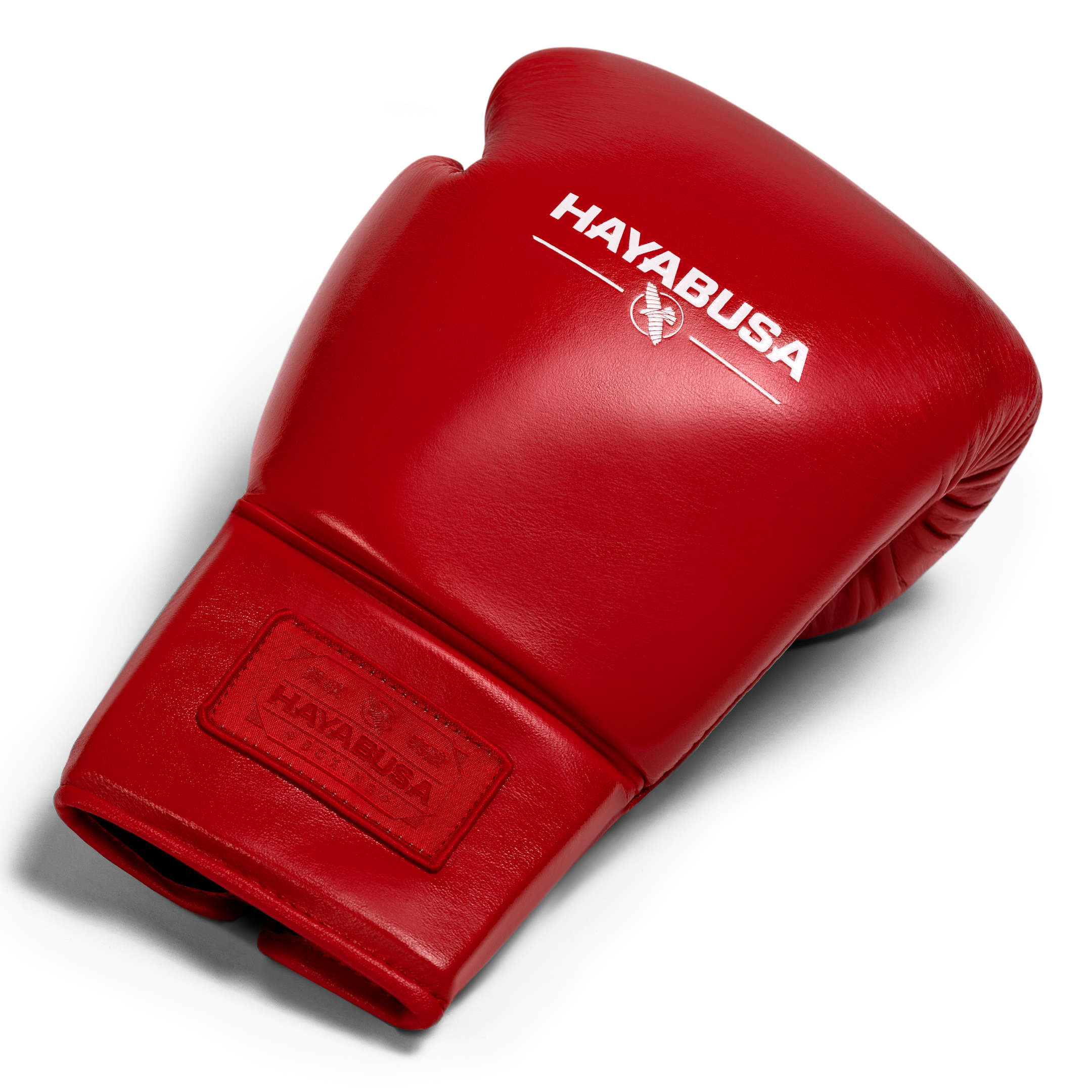 Vista dall'alto di un singolo guantone da boxe rosso Hayabusa Pro Lace, mostrando l'imbottitura e la pelle pieno fiore