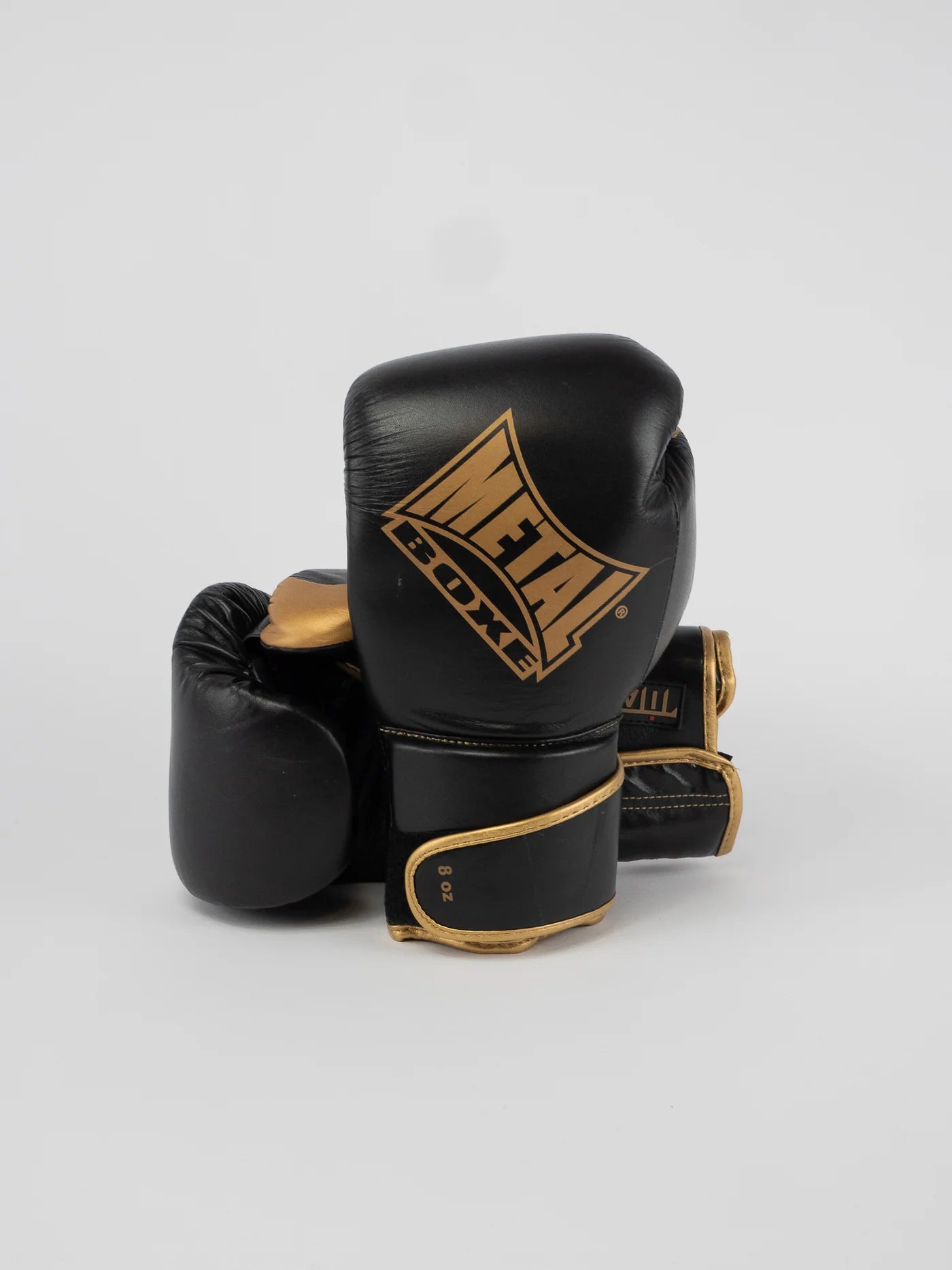 Coppia di guantoni Metal Boxe Titan in pelle nero e oro, vista d'insieme