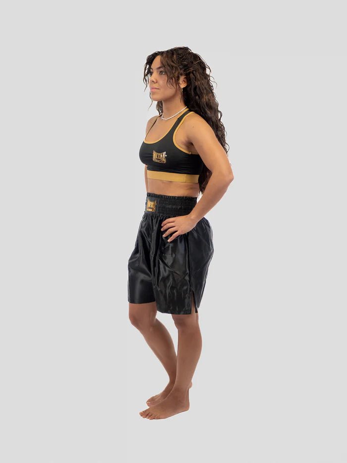 Detail of the elasticated waist and the embroidered logo of the black Metal Boxe Pro Line shorts