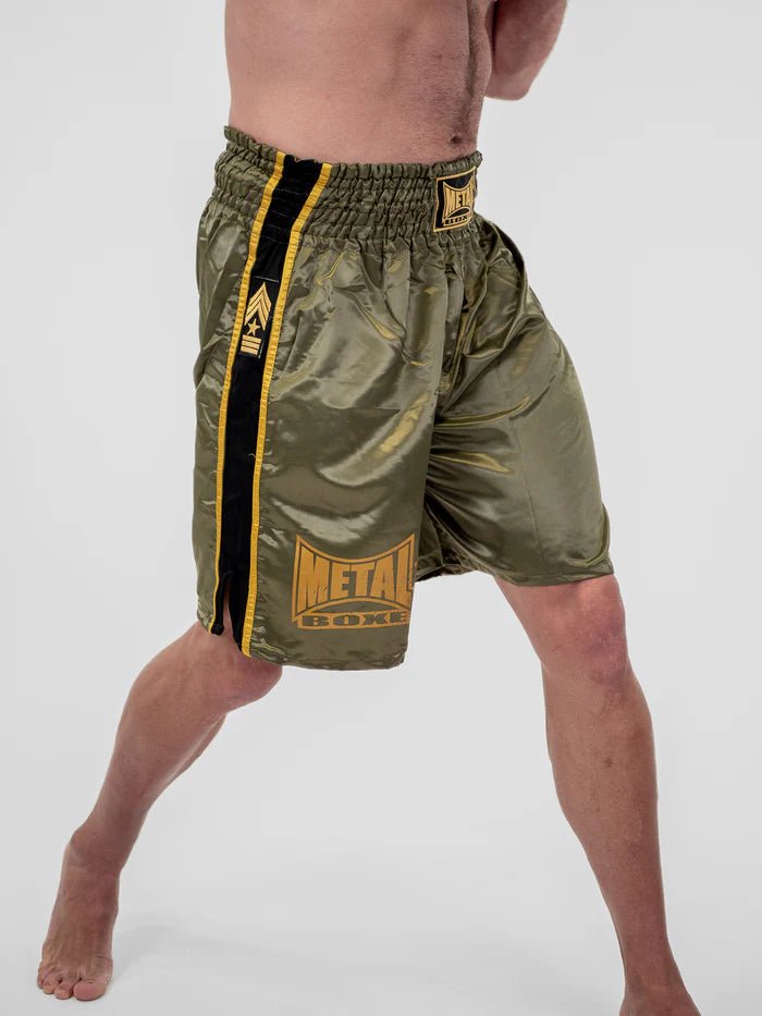 Detail of the satin fabric and gold trim of the green Metal Boxing Pro Line shorts
