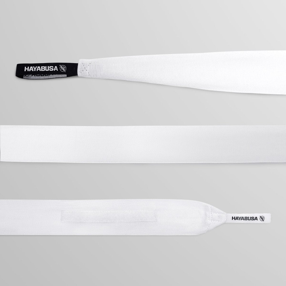 Detalhe do fechamento em velcro de perfil baixo das bandagens de Gaze Hayabusa.