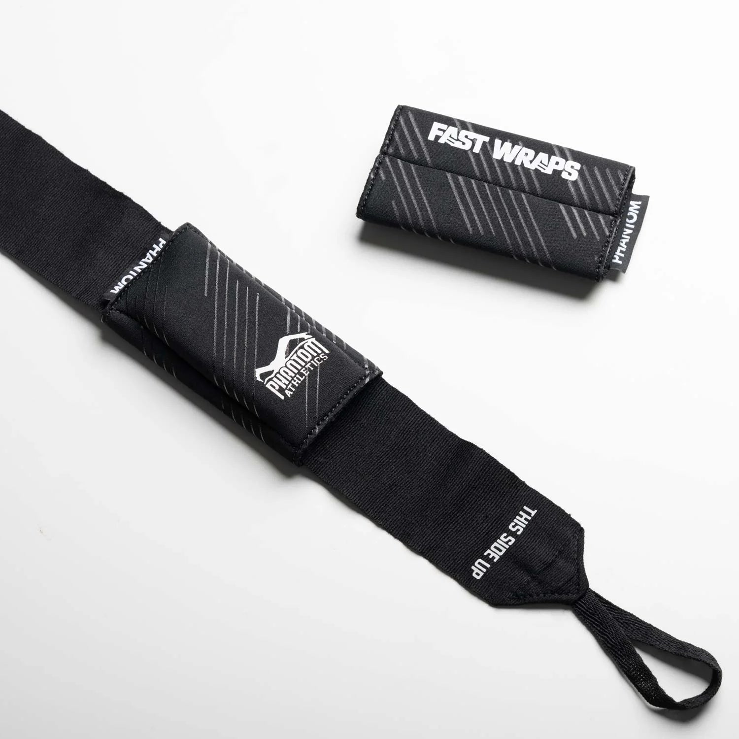 Vista principale della coppia di cuscinetti protettivi neri Phantom FASTWRAPS Wrap-Pads per nocche