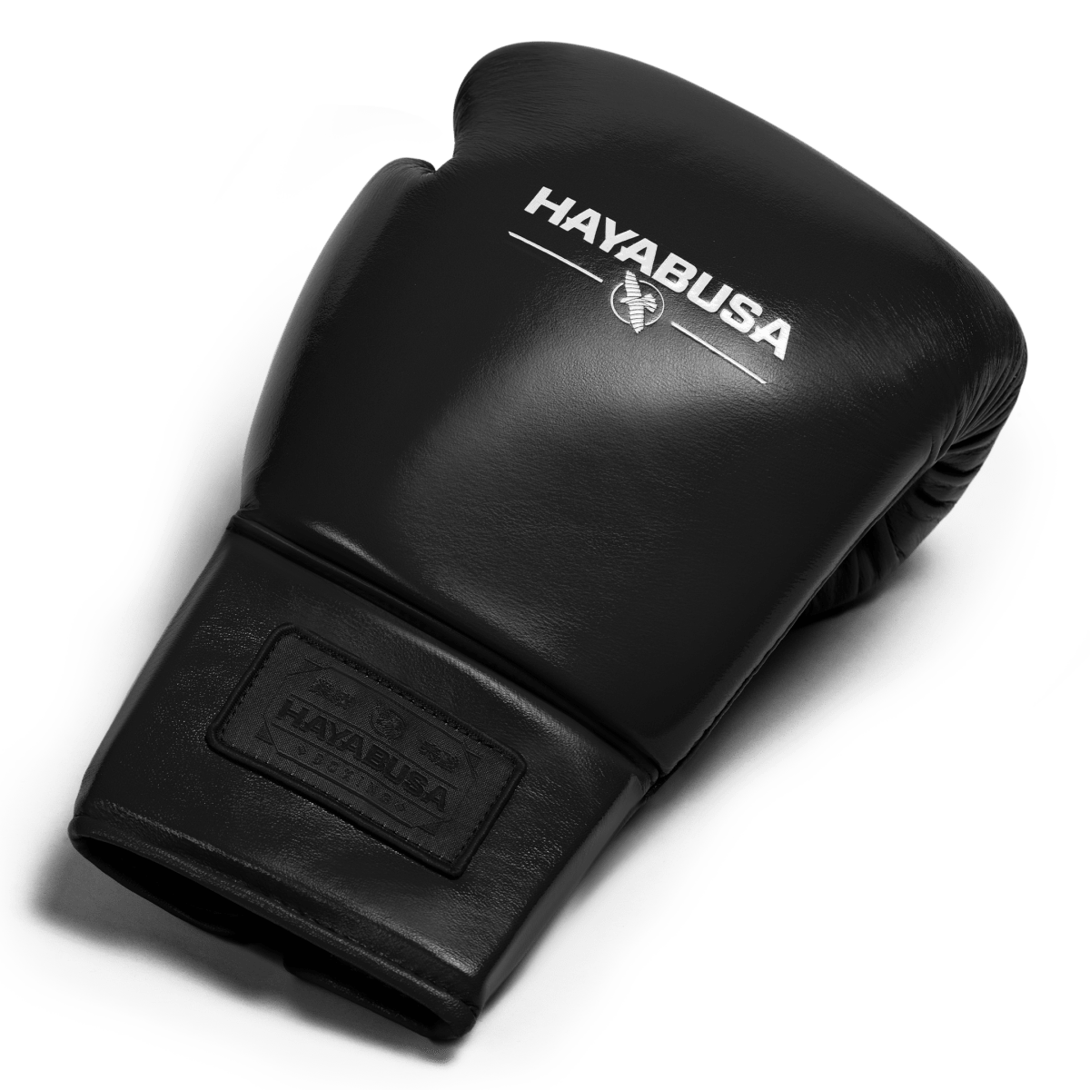 Top view of a single black Hayabusa Pro Lace boxing glove, showing the padding and full grain leather