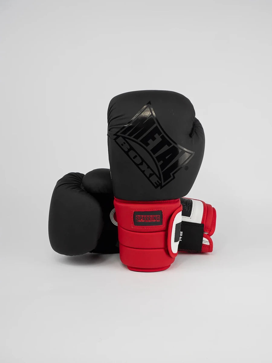Front view of Metal Boxing Sparring Ergo 90 gloves black white red