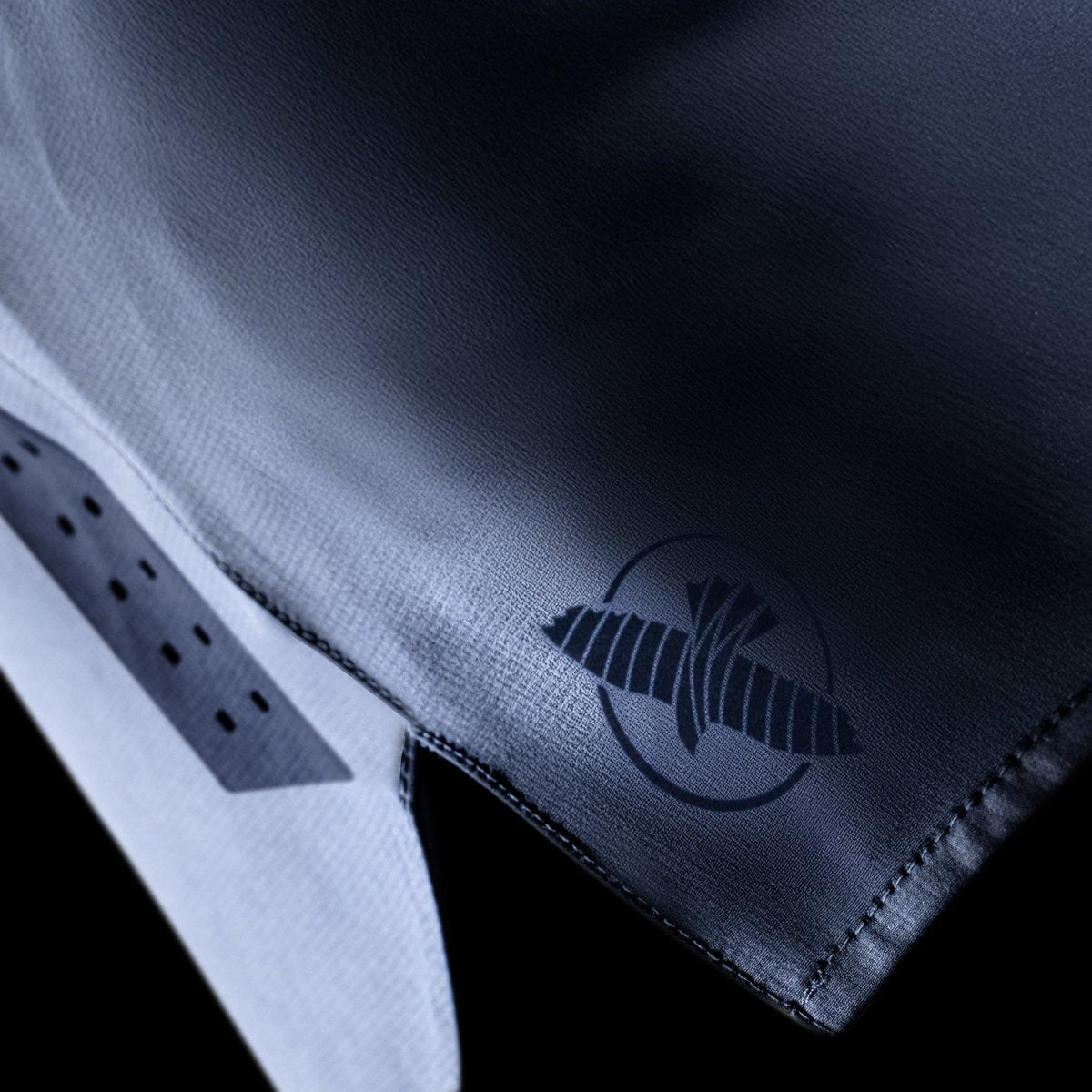 Side detail of the blue Hayabusa Core grappling shorts, detail of the quick-drying fabric