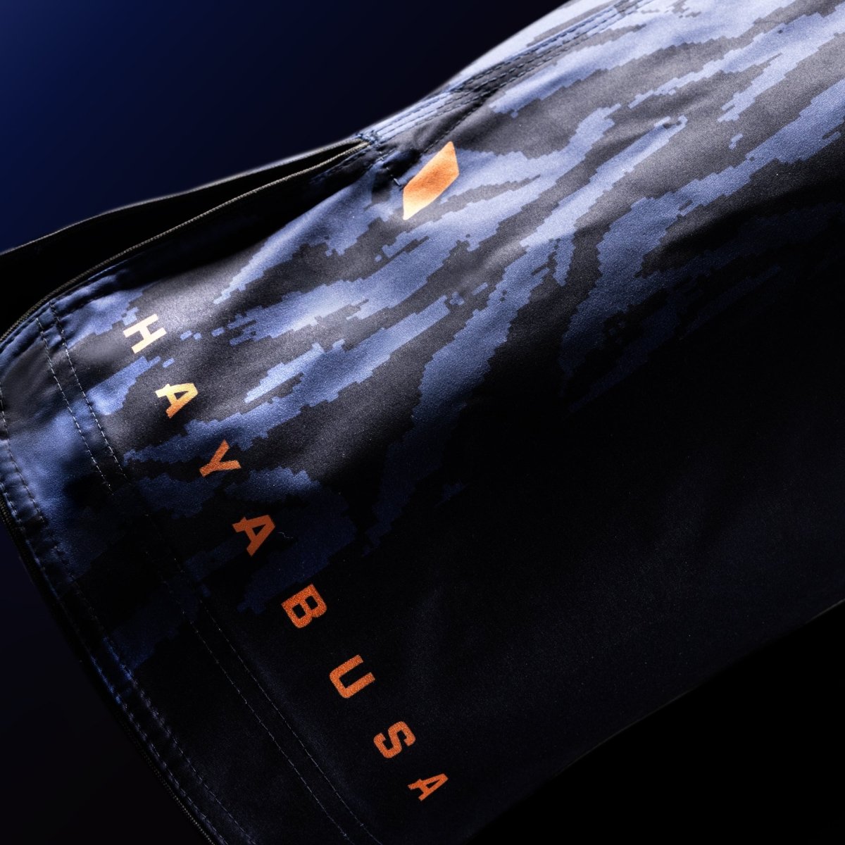 Close-up of the official Hayabusa lettering on the leg of the blue combat shorts