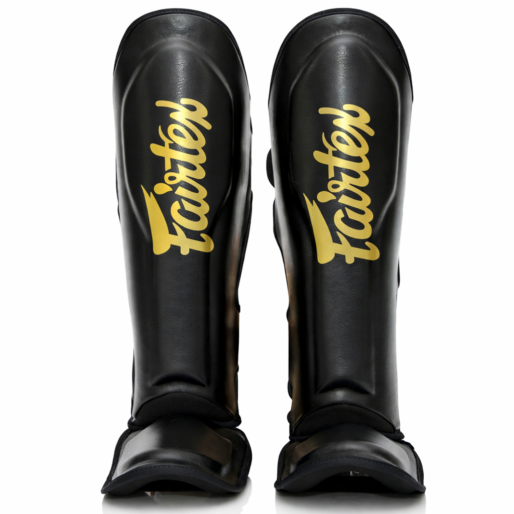 Paratibia FXB Fairtex versione bicolore Nero e Oro con loghi co-branded